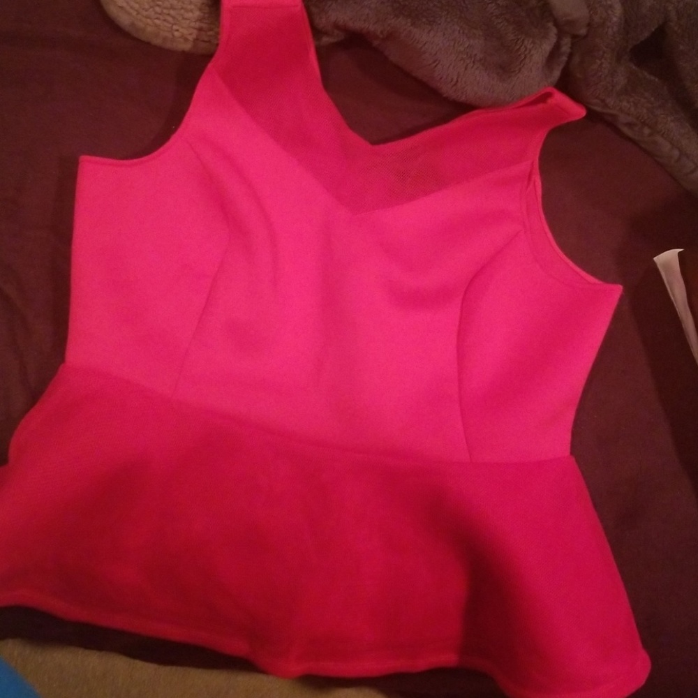 Red peplum sleeveless top.